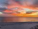 Gorgeous sunset view with vibrant clouds reflecting on the tranquil beach and ocean waters at 13500 Gulf Blvd # 505, Madeira Beach, FL 33708