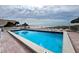 Enjoy the outdoor pool with chairs, tables and shade at 13500 Gulf Blvd # 505, Madeira Beach, FL 33708