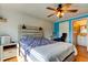 Cozy bedroom with ceiling fan, desk, and an ensuite bathroom, perfect for relaxation and convenience at 136 Sycamore Ln # C, Oldsmar, FL 34677