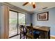 Dining area with a table and chairs adjacent to the outdoor balcony at 136 Sycamore Ln # C, Oldsmar, FL 34677