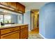 Kitchen with wood cabinetry and tile flooring at 136 Sycamore Ln # C, Oldsmar, FL 34677