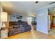 Open-concept living room flowing into the dining area with natural light at 136 Sycamore Ln # C, Oldsmar, FL 34677