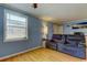 Relaxing living room with ample light, a comfortable sofa and a calming ambiance at 136 Sycamore Ln # C, Oldsmar, FL 34677