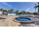 Enjoy the community pool and spa surrounded by ample lounge seating and greenery at 136 Sycamore Ln # C, Oldsmar, FL 34677