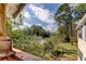 Balcony view showcasing surrounding trees and sky at 136 Sycamore Ln # C, Oldsmar, FL 34677