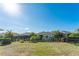 Spacious backyard with lush grass, complemented by dark fencing and well-placed landscaping at 13915 Kingfisher Glen Dr, Lithia, FL 33547