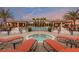 Community pool area featuring a large pool, lounge chairs, and a view of the clubhouse at 13915 Kingfisher Glen Dr, Lithia, FL 33547