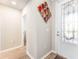 Bright entryway with decorative wall art, a decorative glass door, and access to other rooms at 13915 Kingfisher Glen Dr, Lithia, FL 33547