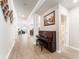 Open concept hallway with a piano, tiled floor, and entrance to bathroom, dining, and office spaces at 13915 Kingfisher Glen Dr, Lithia, FL 33547
