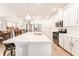 Spacious kitchen features stainless steel appliances, an island with a sink, and white countertops at 13915 Kingfisher Glen Dr, Lithia, FL 33547
