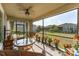 Relaxing screened lanai offers a tranquil outdoor living space surrounded by lush landscaping at 13915 Kingfisher Glen Dr, Lithia, FL 33547