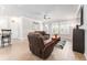 Living room with modern flooring, a ceiling fan, and a neutral paint scheme at 13915 Kingfisher Glen Dr, Lithia, FL 33547