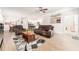 Living room featuring an open-concept design, neutral paint, and wood-look tile flooring at 13915 Kingfisher Glen Dr, Lithia, FL 33547