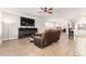 Open-concept living room with modern decor and a large TV, perfect for entertaining and relaxation at 13915 Kingfisher Glen Dr, Lithia, FL 33547