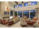 Welcoming lobby with a fireplace, comfortable seating, and stylish light fixtures at 13915 Kingfisher Glen Dr, Lithia, FL 33547