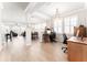 Bright open concept office space with wood look tile floors, white trim, and lots of natural light at 13915 Kingfisher Glen Dr, Lithia, FL 33547