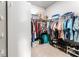 Large walk-in closet with ample hanging and storage space for an organized wardrobe at 13915 Kingfisher Glen Dr, Lithia, FL 33547