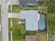 An aerial view of a single Gathering home featuring a screened in pool and fenced backyard at 15306 Winterwind Dr, Tampa, FL 33624
