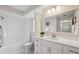 White bathroom featuring a shower/tub combination and modern fixtures at 15306 Winterwind Dr, Tampa, FL 33624