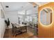 Bright dining room with vaulted ceilings and open floor plan to living room and kitchen at 15306 Winterwind Dr, Tampa, FL 33624