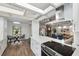 Bright kitchen with stainless steel vent hood, and open view to the dining and living room at 15306 Winterwind Dr, Tampa, FL 33624