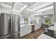 Bright kitchen with stainless steel appliances, including refrigerator and dishwasher at 15306 Winterwind Dr, Tampa, FL 33624