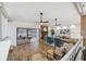Bright open-concept living room featuring wood floors, stone fireplace and access to the pool at 15306 Winterwind Dr, Tampa, FL 33624