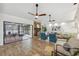 Open concept living room flows to screened patio and backyard with pool views at 15306 Winterwind Dr, Tampa, FL 33624