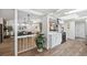 Open floor plan, transitioning from the kitchen to the living room at 15306 Winterwind Dr, Tampa, FL 33624