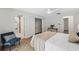 Bright main bedroom with ceiling fan and access to ensuite bathroom at 15306 Winterwind Dr, Tampa, FL 33624