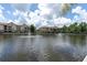 Scenic water view featuring fountains in a lake and residential buildings in the background at 1610 Raena Dr # 107, Odessa, FL 33556