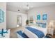 Bedroom with nautical decor features a large window overlooking a sparkling pool at 18908 Fairwood Ct, Tampa, FL 33647