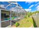 Enjoy this beautiful backyard, featuring a screened-in pool and spa, and lush landscaping at 20330 Natures Corner Dr, Tampa, FL 33647