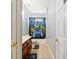 Bathroom featuring a single vanity, toilet, and tub shower with a gamer shower curtain at 20330 Natures Corner Dr, Tampa, FL 33647