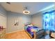 Charming bedroom with stylish furniture, a ceiling fan, and tile flooring at 20330 Natures Corner Dr, Tampa, FL 33647