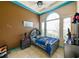 The bedroom has a unique ceiling design and is decorated with a space theme at 20330 Natures Corner Dr, Tampa, FL 33647