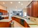 Kitchen featuring dark cabinets, stainless steel appliances, and white countertops at 20330 Natures Corner Dr, Tampa, FL 33647