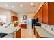 Kitchen featuring dark cabinets, stainless steel appliances, and white countertops at 20330 Natures Corner Dr, Tampa, FL 33647