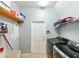 Laundry room with modern washer and dryer and ample storage space at 20330 Natures Corner Dr, Tampa, FL 33647