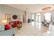Spacious living room featuring tile flooring, high ceilings, and elegant furnishings at 20330 Natures Corner Dr, Tampa, FL 33647