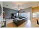 Large living room featuring a TV, ceiling fan and view of kitchen area at 20330 Natures Corner Dr, Tampa, FL 33647