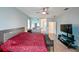 Bright main bedroom features a ceiling fan, tiled floor, and ensuite access at 20330 Natures Corner Dr, Tampa, FL 33647