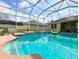 Relax in this screened-in pool with brick surround and spa, perfect for Florida living at 20330 Natures Corner Dr, Tampa, FL 33647