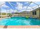 Enjoy this beautiful screened-in pool with a brick surround and attached spa for outdoor relaxation at 20330 Natures Corner Dr, Tampa, FL 33647