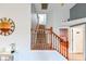 An entryway staircase with wooden railings and gray walls leading to the upper level at 20330 Natures Corner Dr, Tampa, FL 33647