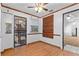 Bright dining room featuring laminate floors, white walls, and a ceiling fan at 2045 11Th S St, St Petersburg, FL 33705