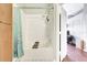 Clean bathroom featuring a bathtub with shower and stylish shower curtain at 2352 Lake Woodberry Cir, Brandon, FL 33510