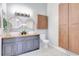 Stylish bathroom with double sinks, modern fixtures, decorative tile flooring, and ample storage space at 2352 Lake Woodberry Cir, Brandon, FL 33510