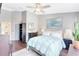 Bright bedroom with a comfortable bed, serene artwork, and ample natural light at 2352 Lake Woodberry Cir, Brandon, FL 33510