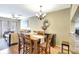 An elegant dining room with hardwood floors and a stylish chandelier at 2352 Lake Woodberry Cir, Brandon, FL 33510